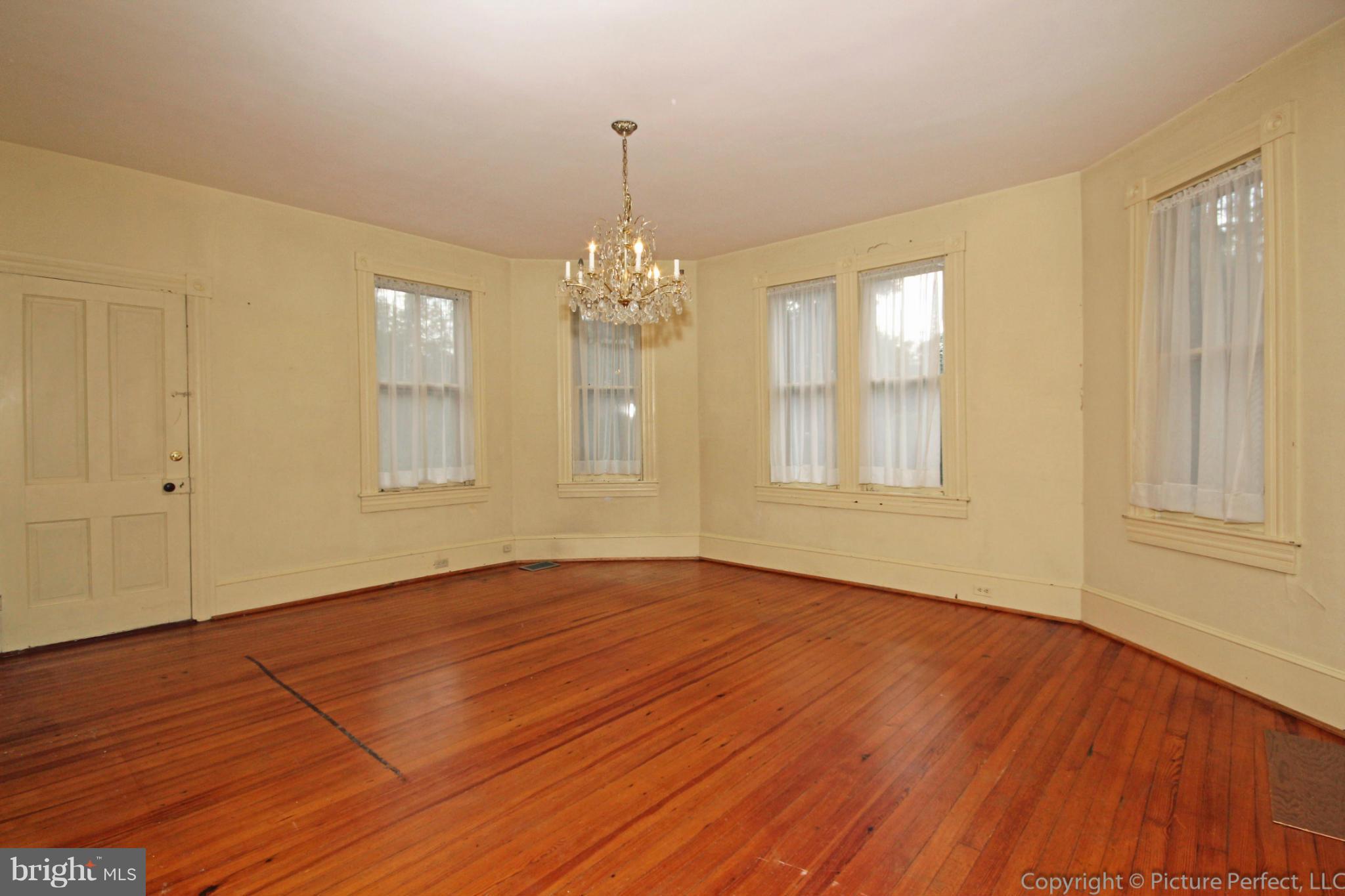 1801 Long Corner Road Mount Airy, MD 21771 - Photo 11 of 30 a view of empty room with wooden floor and fan