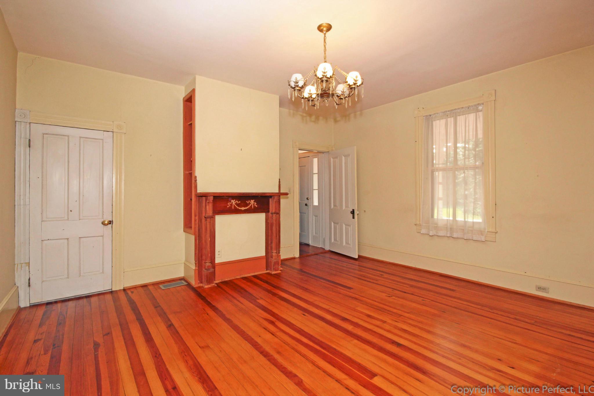 1801 Long Corner Road Mount Airy, MD 21771 - Photo 13 of 30 wooden floor in an empty room with a window