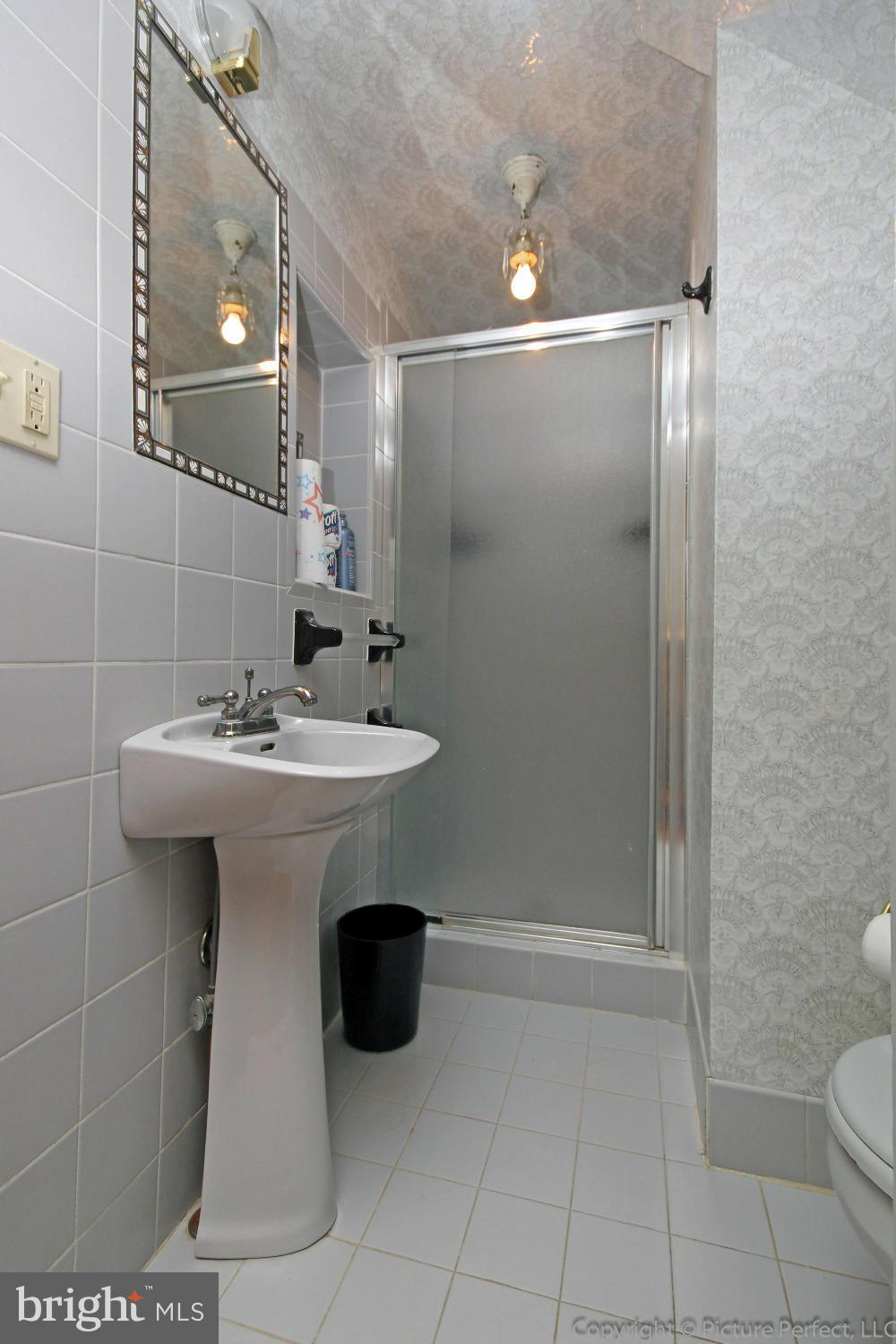 1801 Long Corner Road Mount Airy, MD 21771 - Photo 15 of 30 a bathroom with a sink toilet and shower