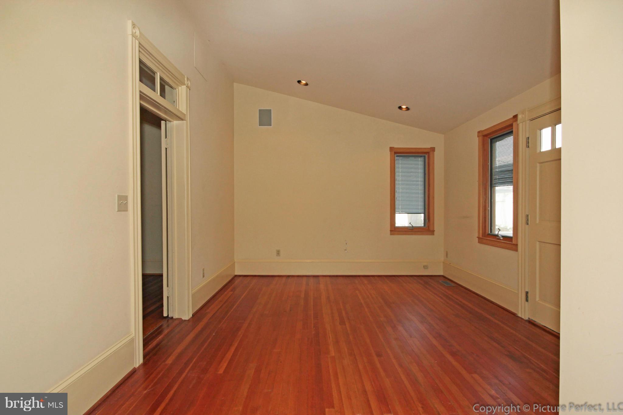 1801 Long Corner Road Mount Airy, MD 21771 - Photo 18 of 30 a view of an empty room with wooden floor and a window