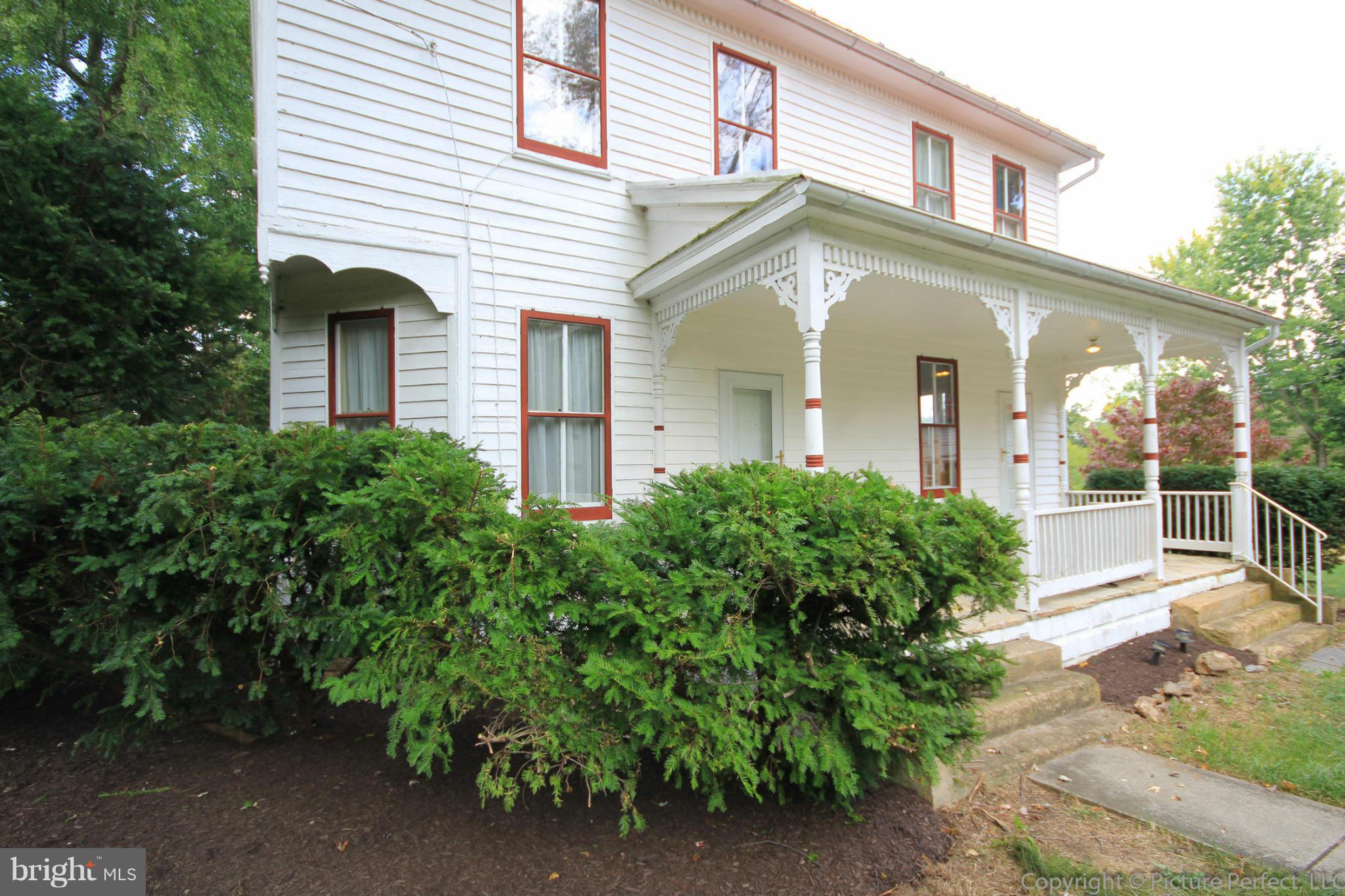 1801 Long Corner Road Mount Airy, MD 21771 - Photo 5 of 30 a front view of a house with garden