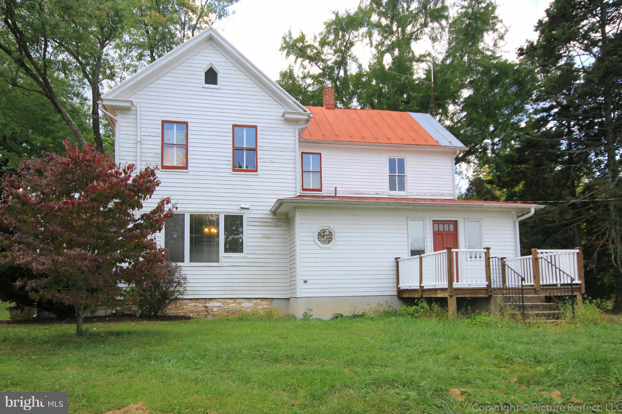 1801 Long Corner Road Mount Airy, MD 21771 - Photo 6 of 30 a front view of house with yard and trees