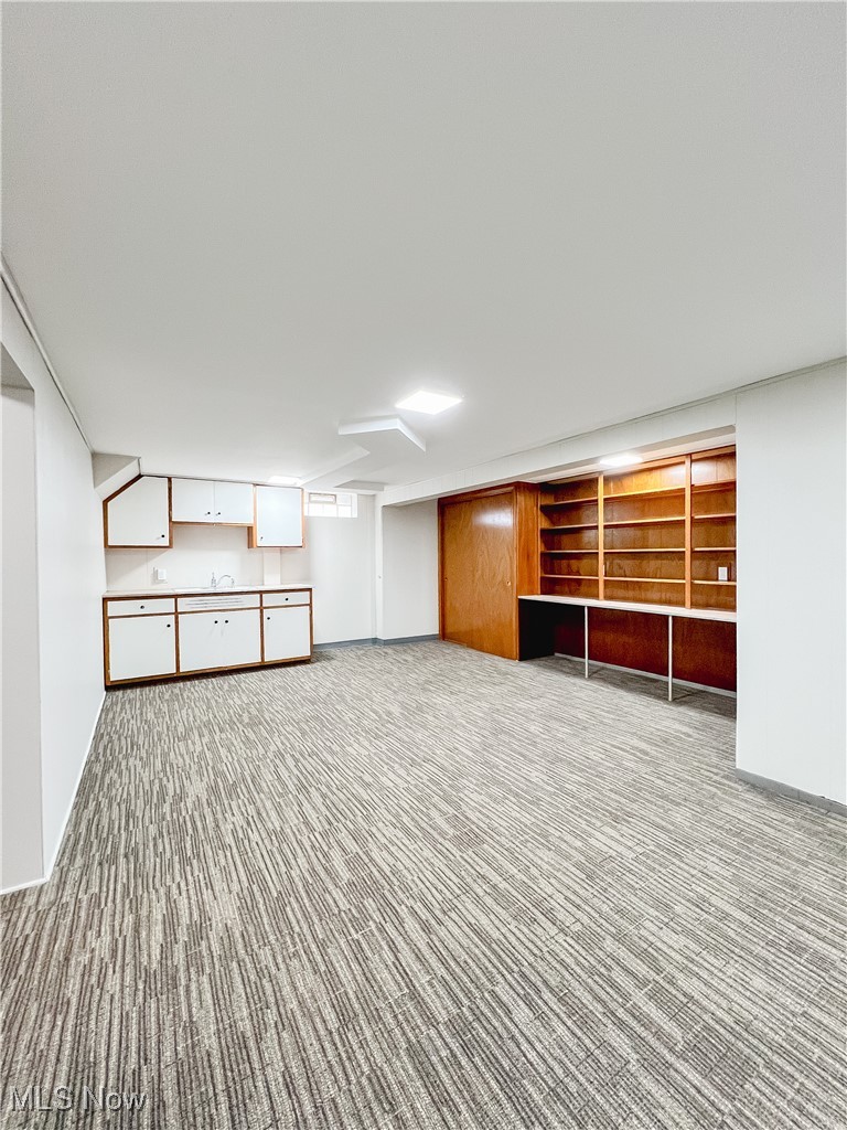 6403 Kenneth Avenue Parma, OH 44129 - Photo 17 of 20 Finished below grade area with baseboards and carpet floors