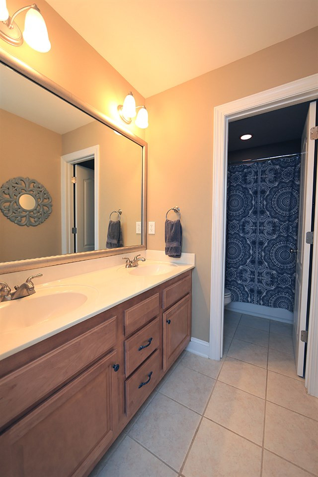 1721 Bayleaf Trail Raleigh, NC 27614 - Photo 23 of 30 Dual sinks. Door to toilet and tub/shower. Hall Bath