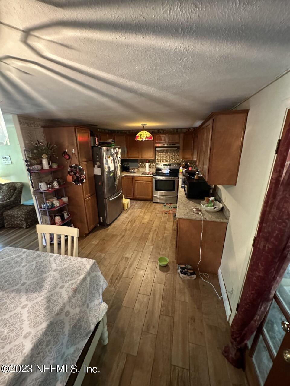4479 Vinton Road Jacksonville, FL 32207 - Photo 13 of 45 a living room with furniture and a wooden floor
