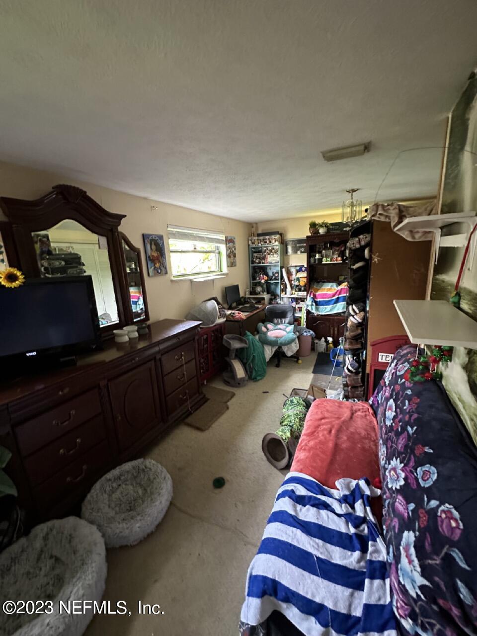 4479 Vinton Road Jacksonville, FL 32207 - Photo 24 of 45 a living room with furniture and a rug