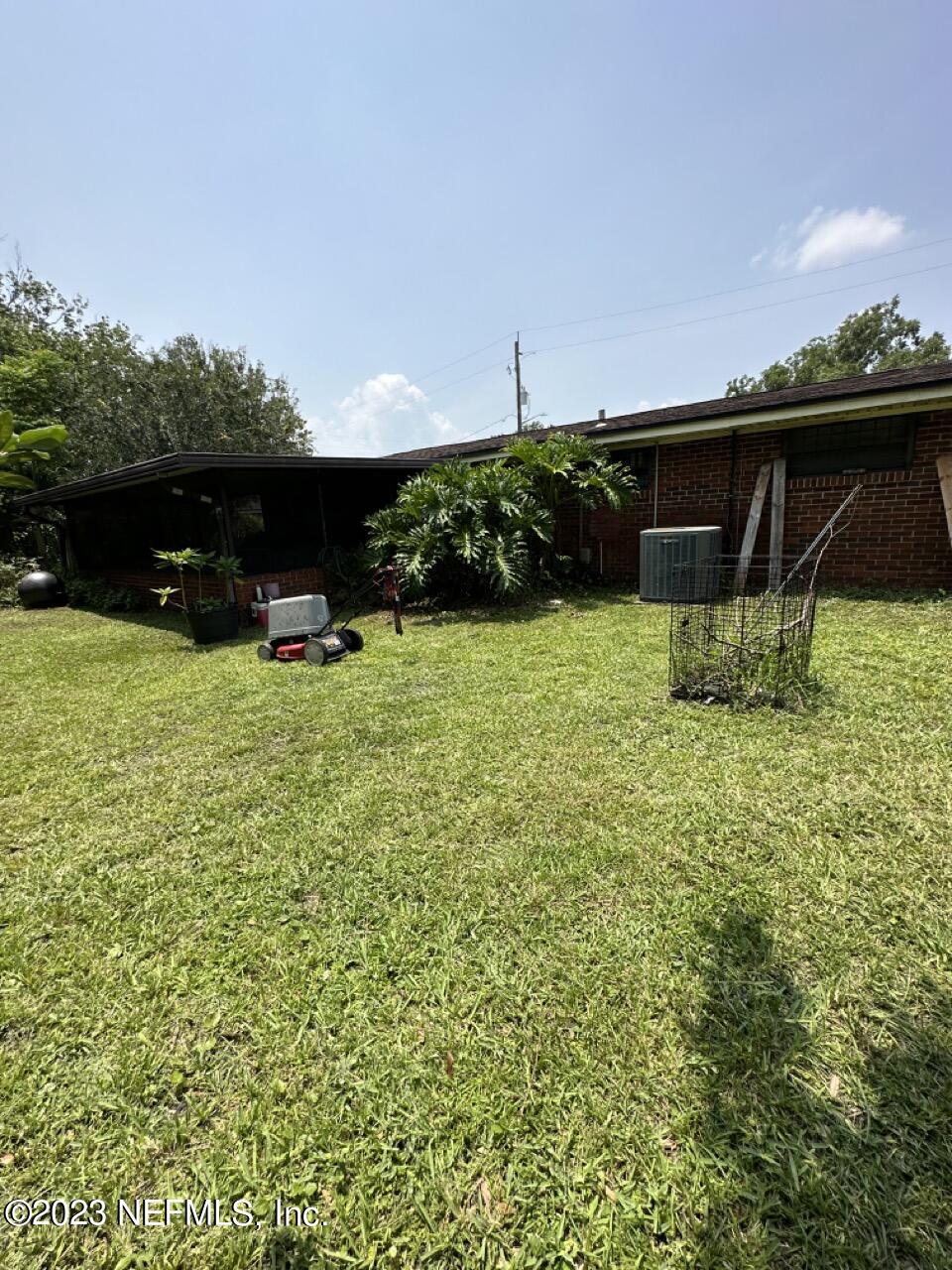 4479 Vinton Road Jacksonville, FL 32207 - Photo 45 of 45 a backyard of a house with lots of green space