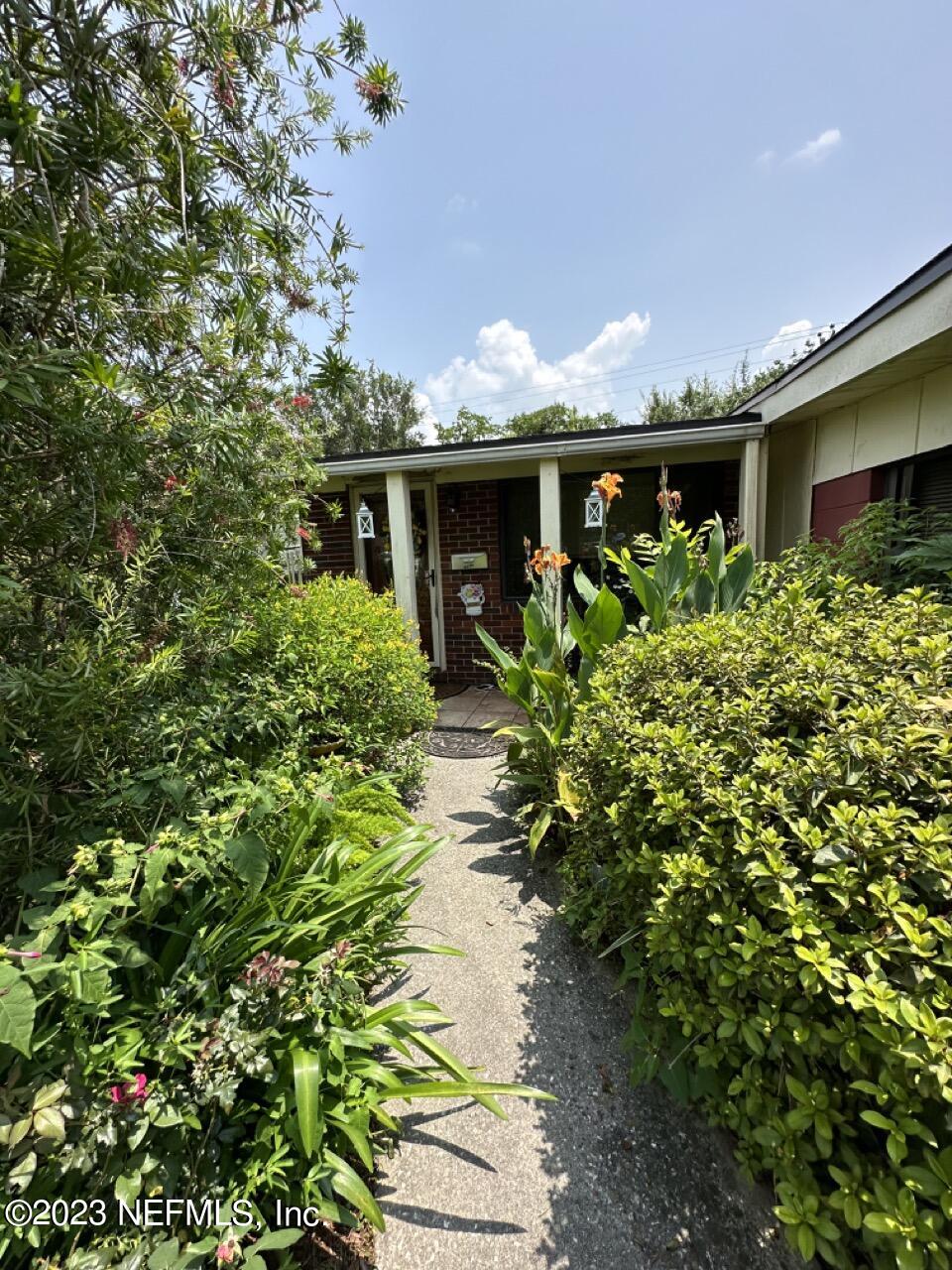4479 Vinton Road Jacksonville, FL 32207 - Photo 5 of 45 a front view of a house with a yard