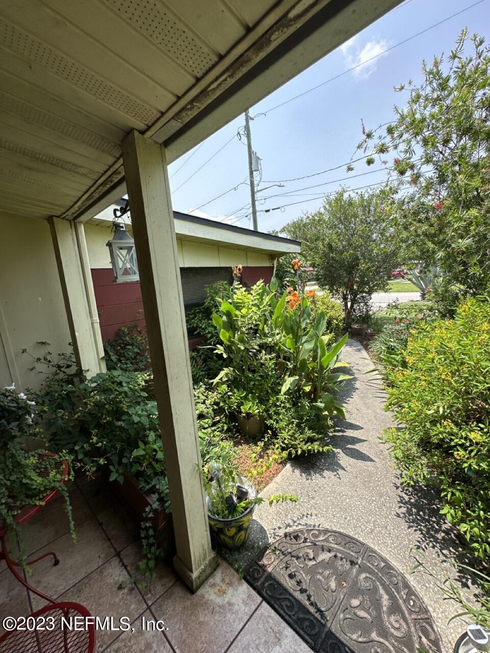 4479 Vinton Road Jacksonville, FL 32207 - Photo 6 of 45 a couple of flower plants in front of door