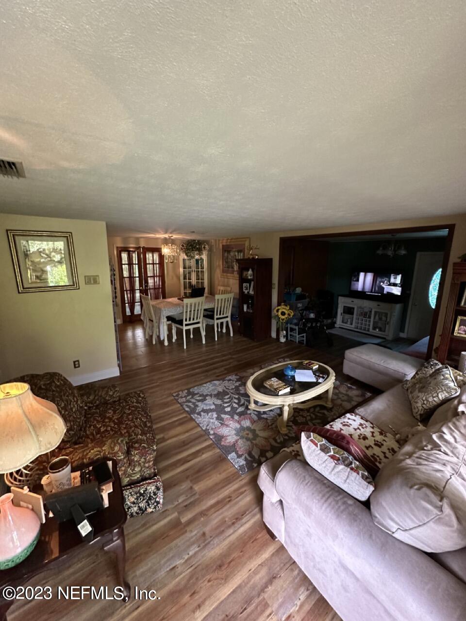 4479 Vinton Road Jacksonville, FL 32207 - Photo 9 of 45 a living room with furniture and a fireplace