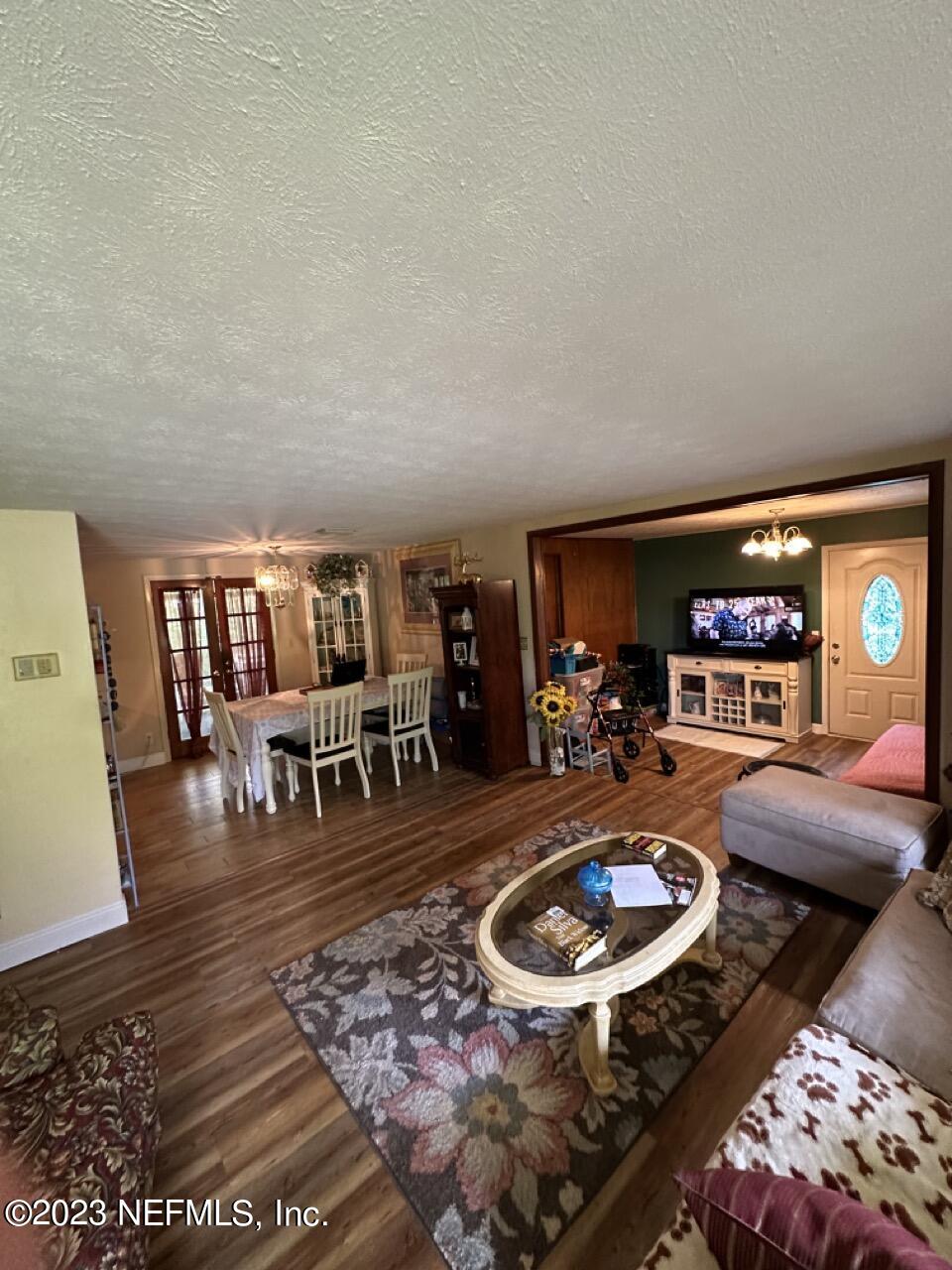4479 Vinton Road Jacksonville, FL 32207 - Photo 10 of 45 a living room with furniture and a dining table