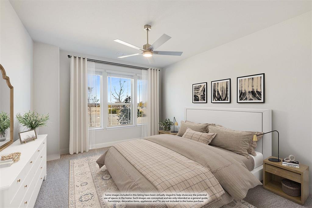 7316 Iris Road Aubrey, TX 76227 - Photo 24 of 40 a spacious bedroom with a large bed and a chandelier