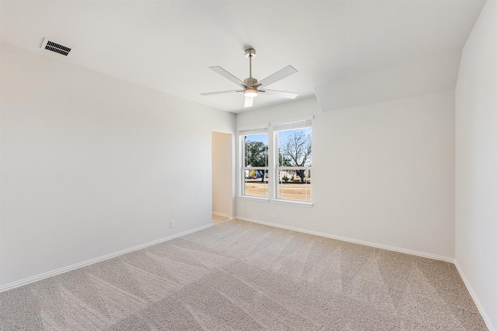 7316 Iris Road Aubrey, TX 76227 - Photo 32 of 40 a view of an empty room with a window