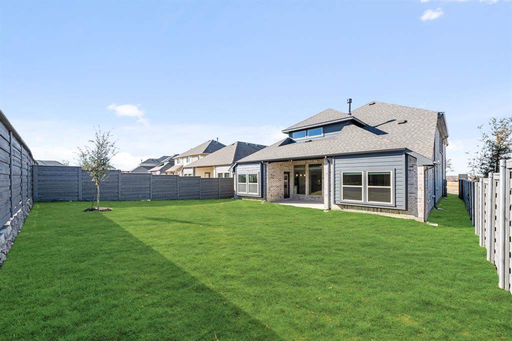 7316 Iris Road Aubrey, TX 76227 - Photo 39 of 40 a front view of a house with a yard