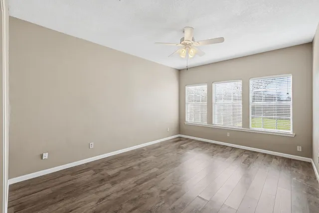 a bathroom with a bathtub and a window