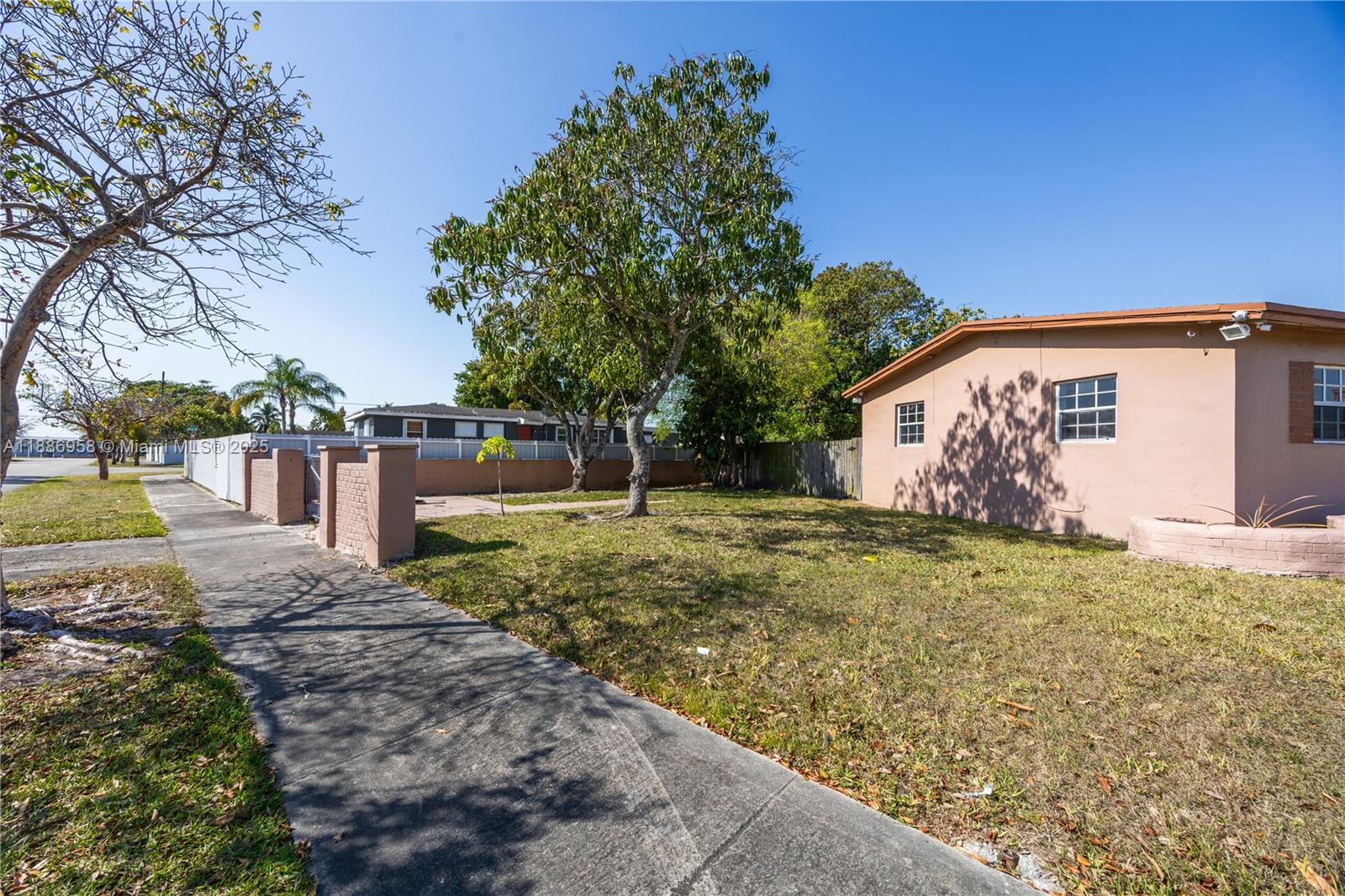 11500 Southwest 142nd Street Miami, FL 33176 - Photo 12 of 35 a backyard of a house with large trees