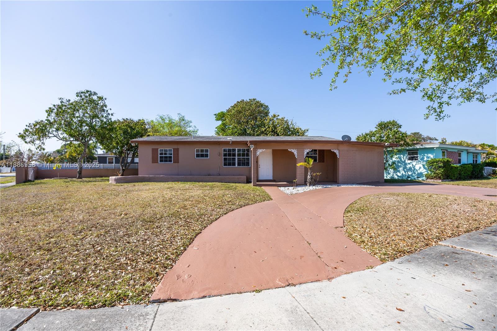 11500 Southwest 142nd Street Miami, FL 33176 - Photo 15 of 35 front view of house with a yard