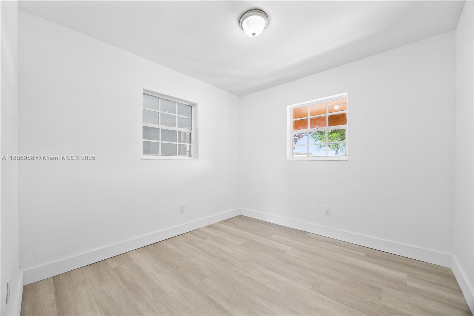 11500 Southwest 142nd Street Miami, FL 33176 - Photo 23 of 35 an empty room with wooden floor and window