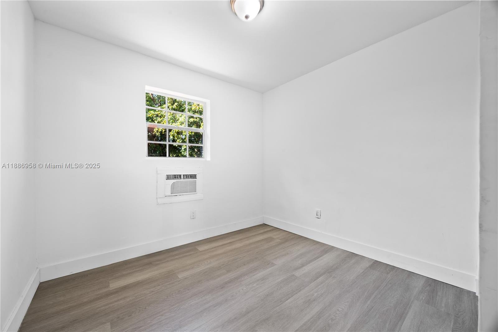 11500 Southwest 142nd Street Miami, FL 33176 - Photo 30 of 35 wooden floor in an empty room with a window