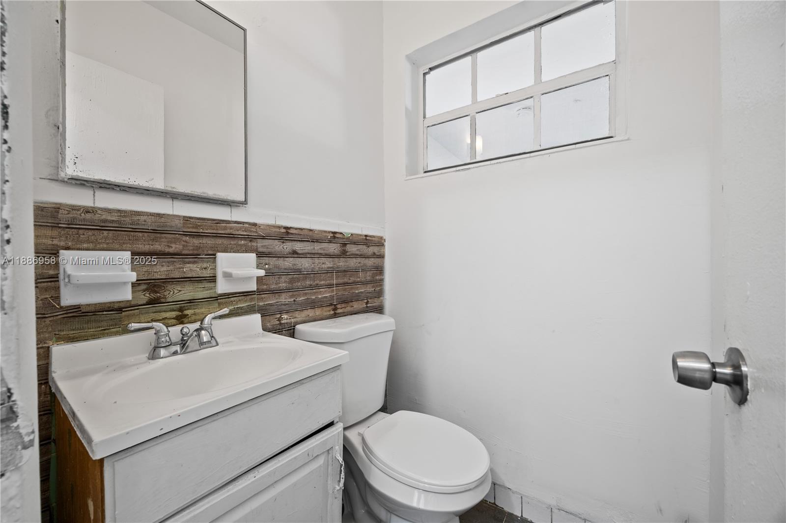 11500 Southwest 142nd Street Miami, FL 33176 - Photo 31 of 35 a bathroom with a sink a toilet and mirror