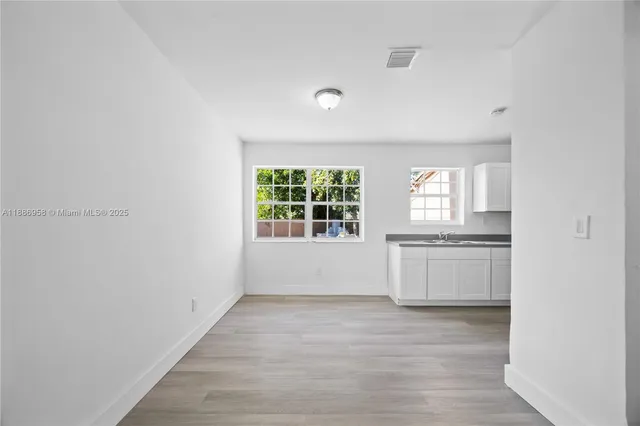 a view of an empty room with a window