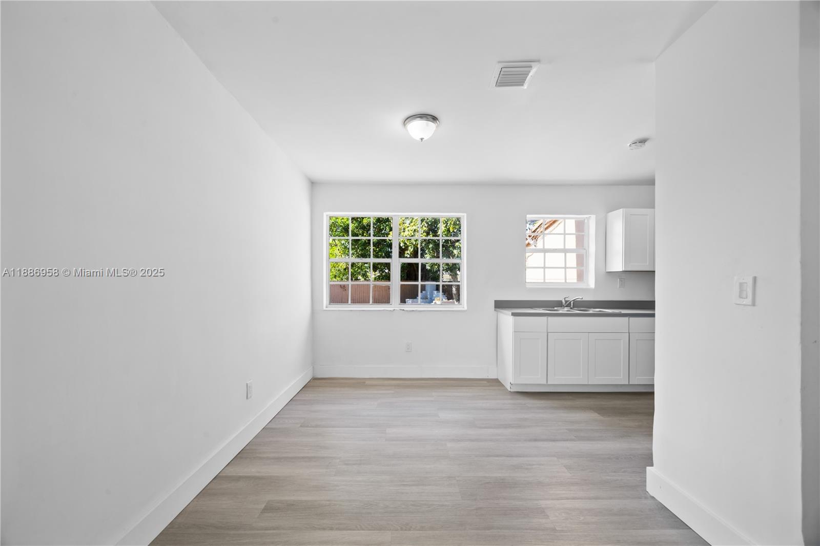 11500 Southwest 142nd Street Miami, FL 33176 - Photo 6 of 35 a view of an empty room with a window