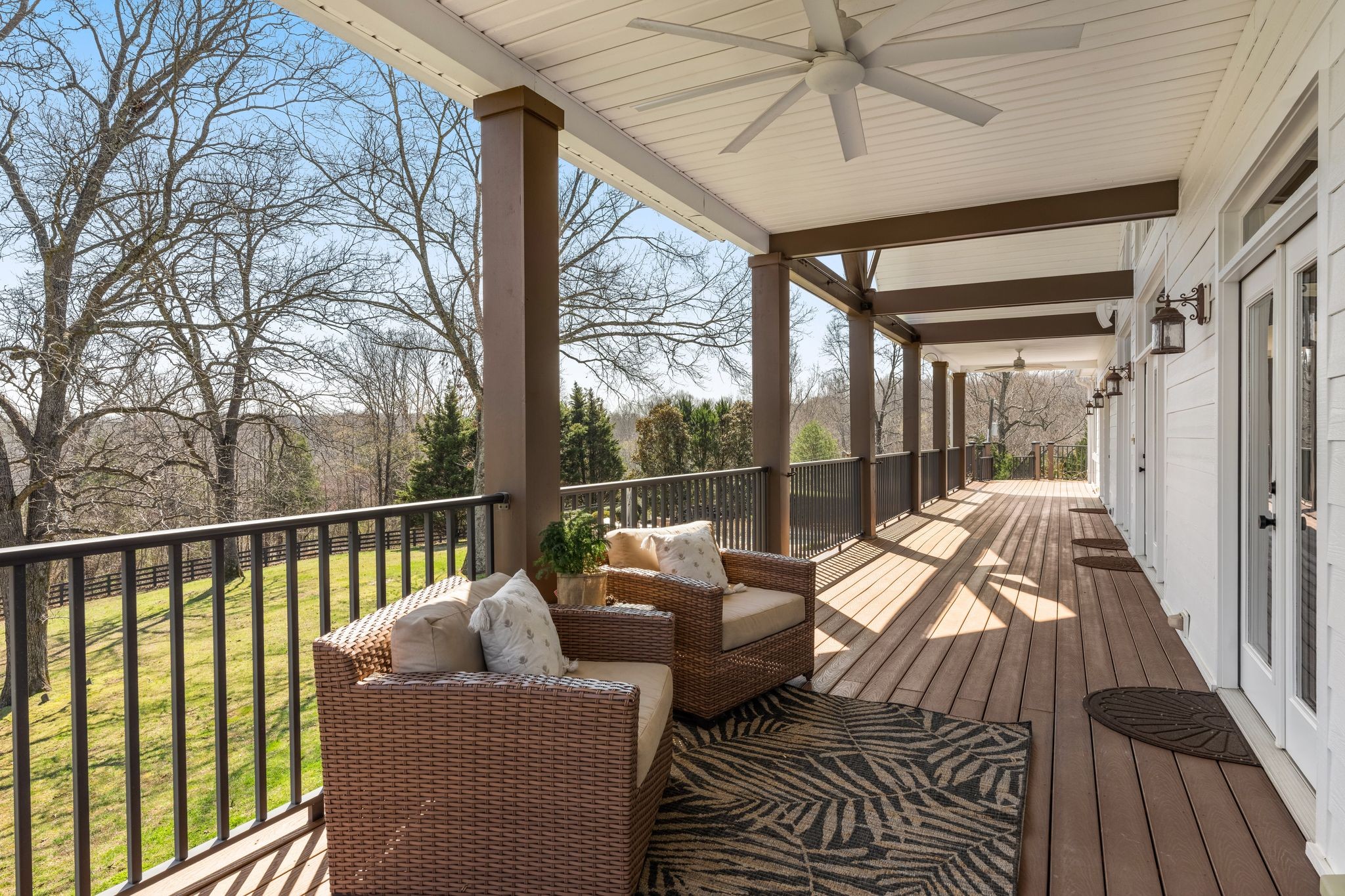7200 Kingston Road Fairview, TN 37062 - Photo 17 of 68 a balcony with couch and wooden floor