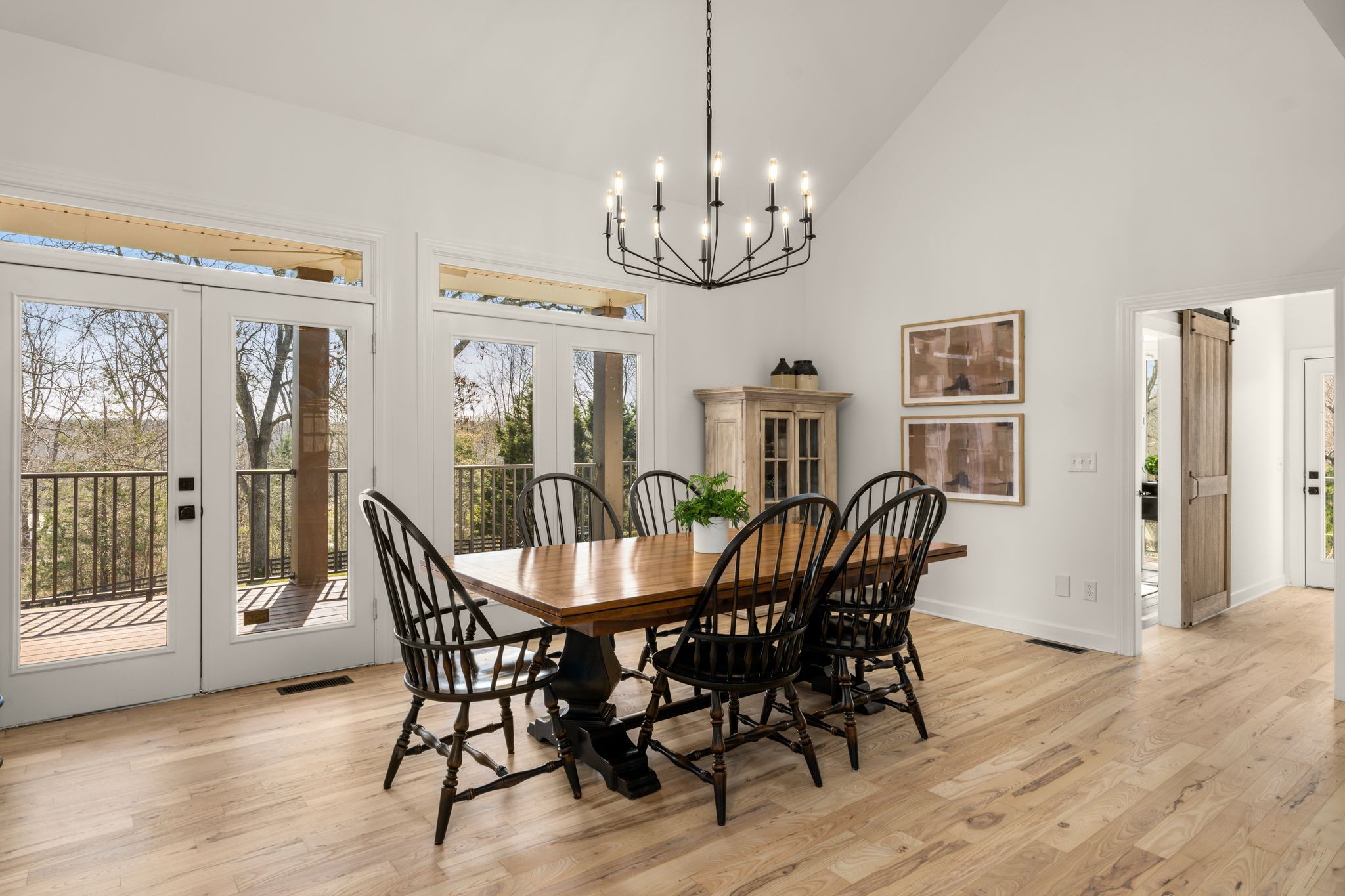 7200 Kingston Road Fairview, TN 37062 - Photo 21 of 68 a view of a dining room with furniture wooden floor and chandelier