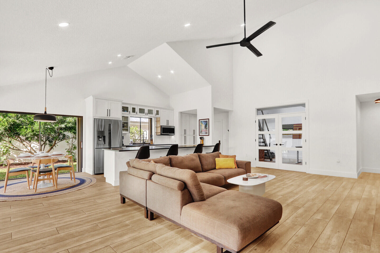246 Ridge Road Jupiter, FL 33477 - Photo 11 of 39 a living room with furniture and a large window