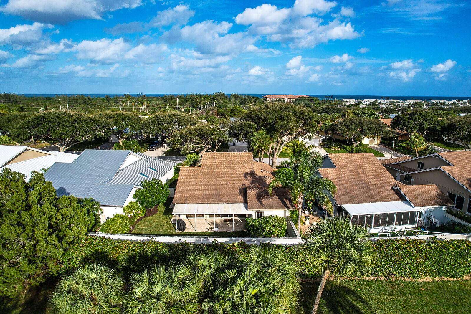 246 Ridge Road Jupiter, FL 33477 - Photo 31 of 39 an aerial view of residential houses with outdoor space and ocean view