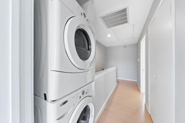 a view of a hallway with washer and dryer