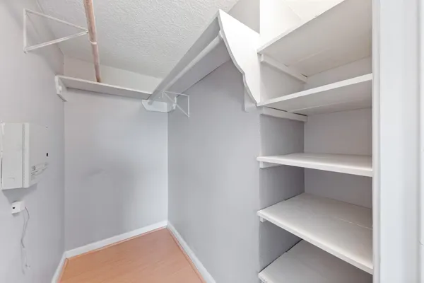 a view of an empty walk in closet