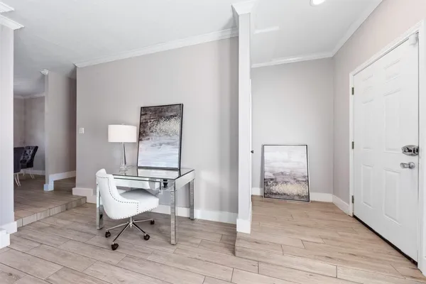 a view of room with furniture and wooden floor