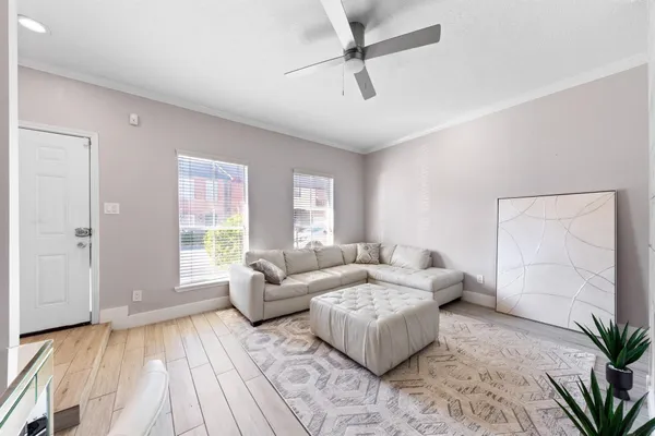 a living room with furniture and a large window