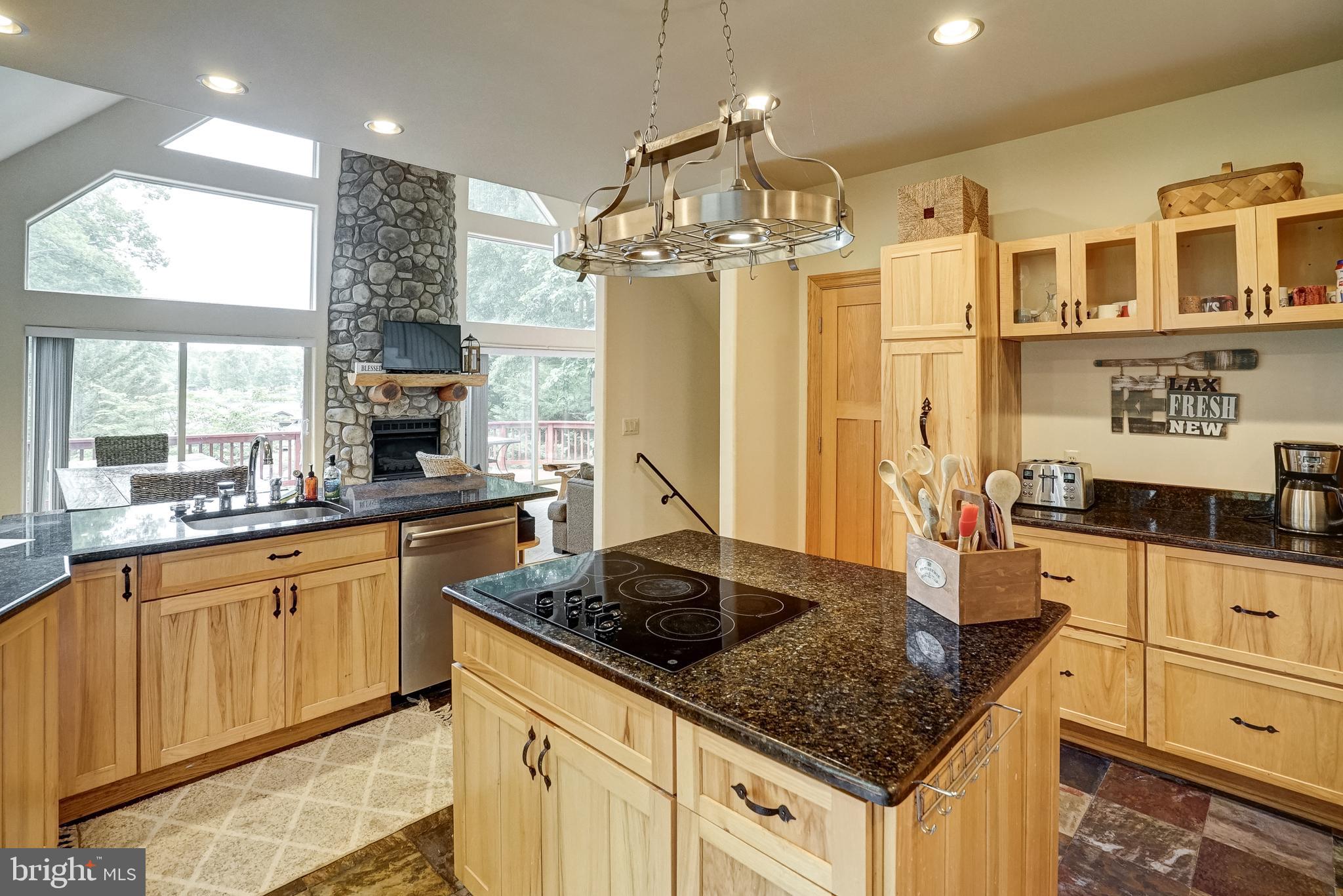 155 Irish Way Bumpass, VA 23024 - Photo 19 of 60 a kitchen with stainless steel appliances granite countertop a sink stove and refrigerator