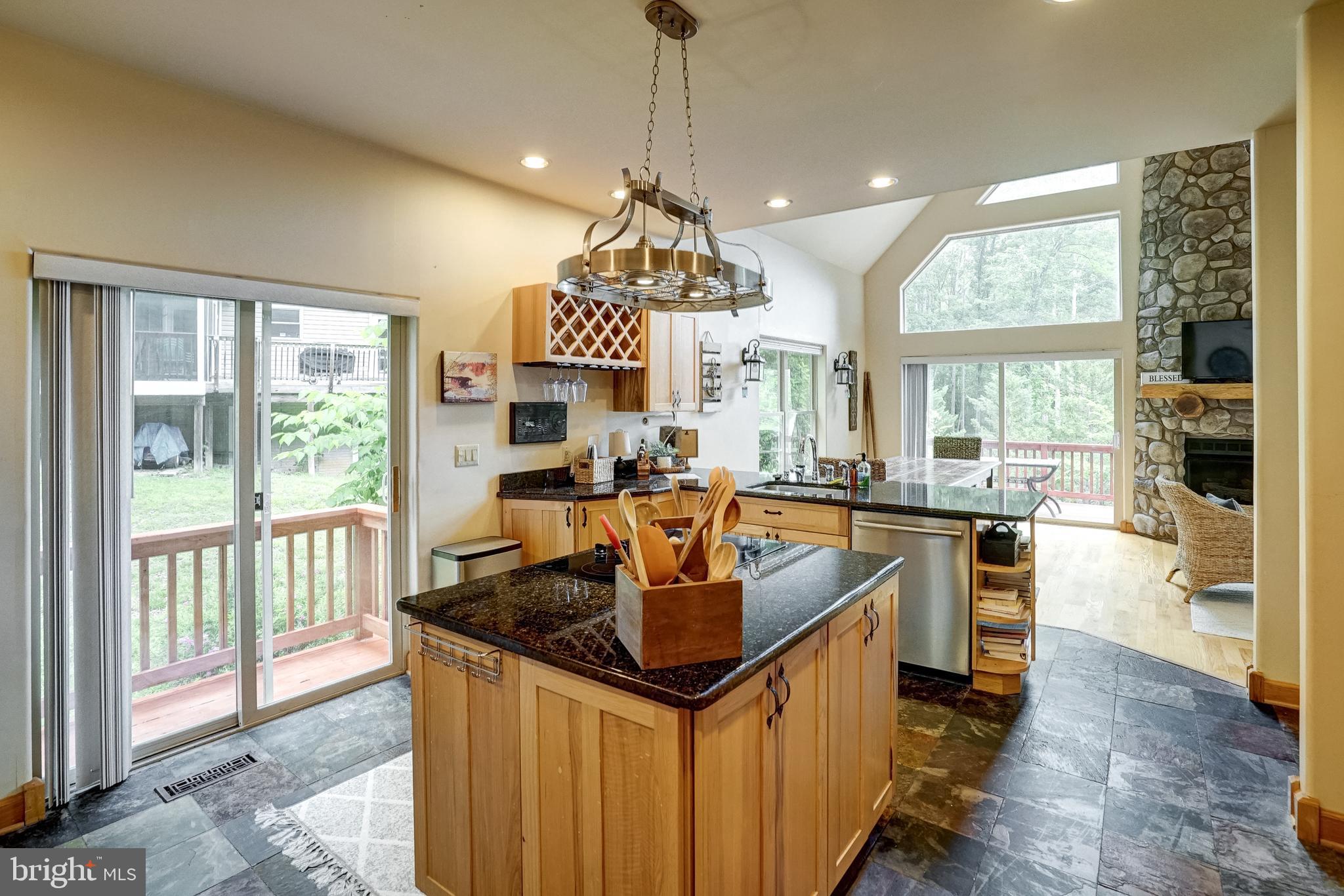155 Irish Way Bumpass, VA 23024 - Photo 20 of 60 a kitchen with stainless steel appliances granite countertop a sink a stove and a wooden floors
