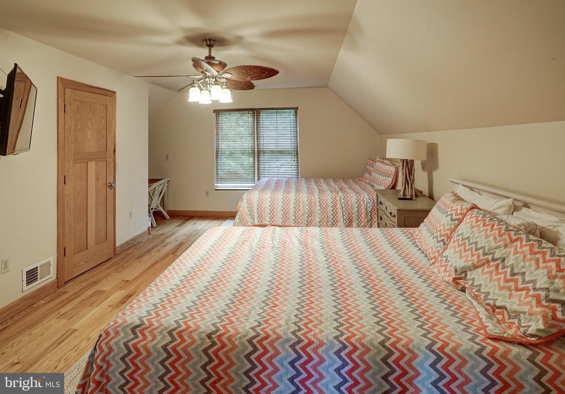 155 Irish Way Bumpass, VA 23024 - Photo 32 of 60 a bedroom with a bed and a chandelier