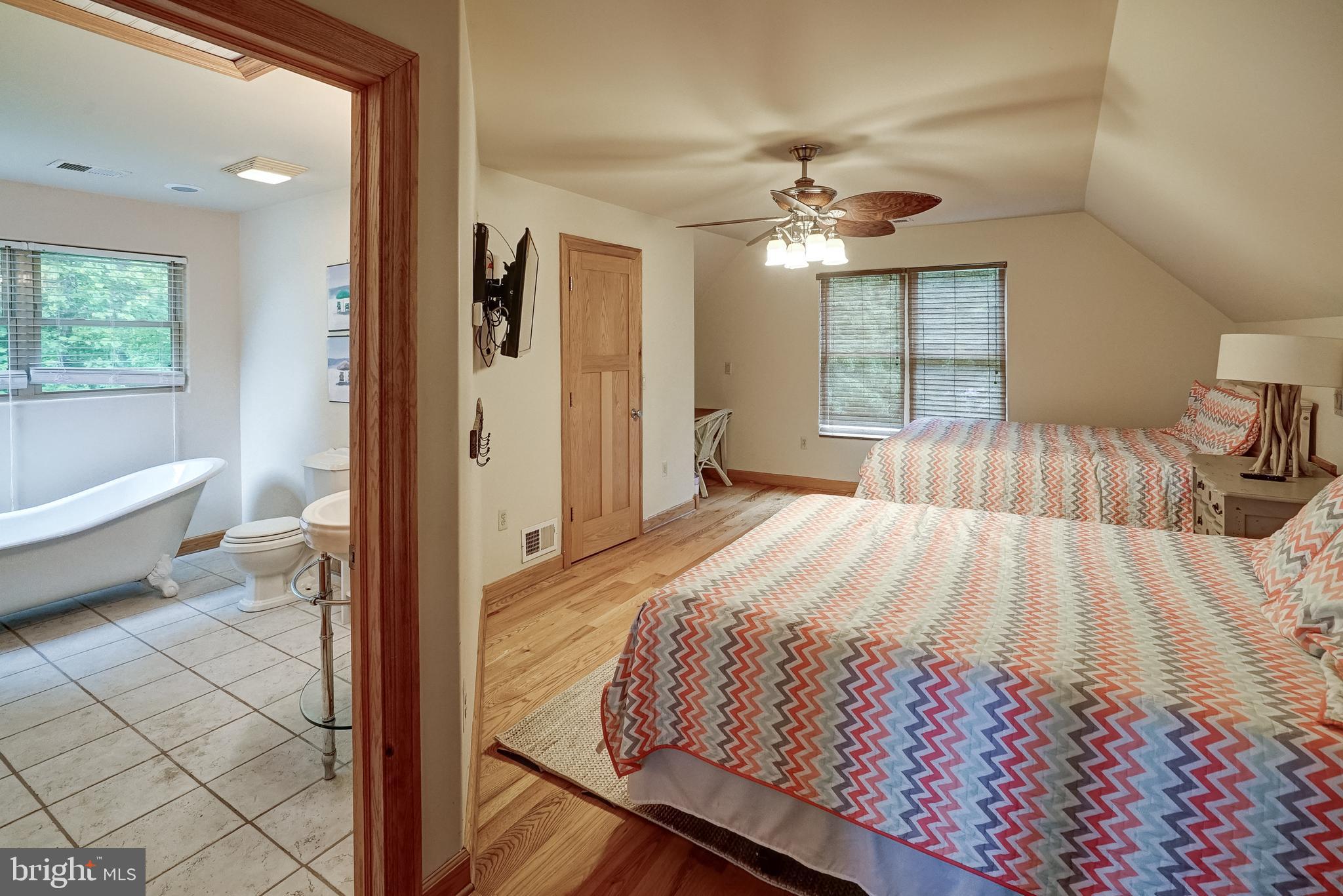 155 Irish Way Bumpass, VA 23024 - Photo 33 of 60 a bedroom with a bed and a chandelier