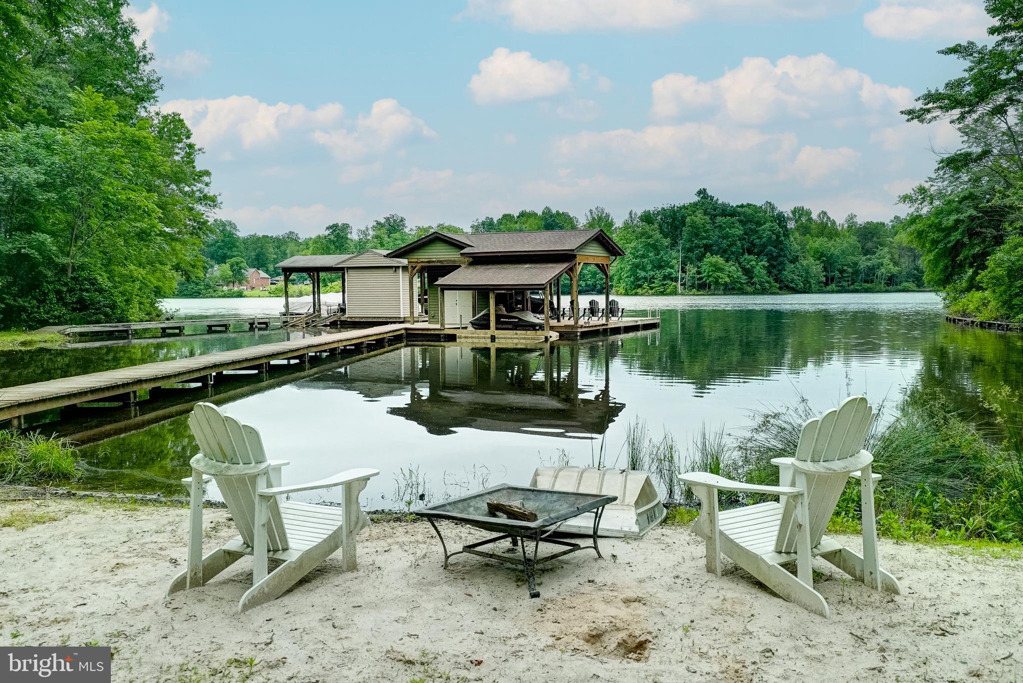 155 Irish Way Bumpass, VA 23024 - Photo 5 of 60 a view of a lake with a table and chairs