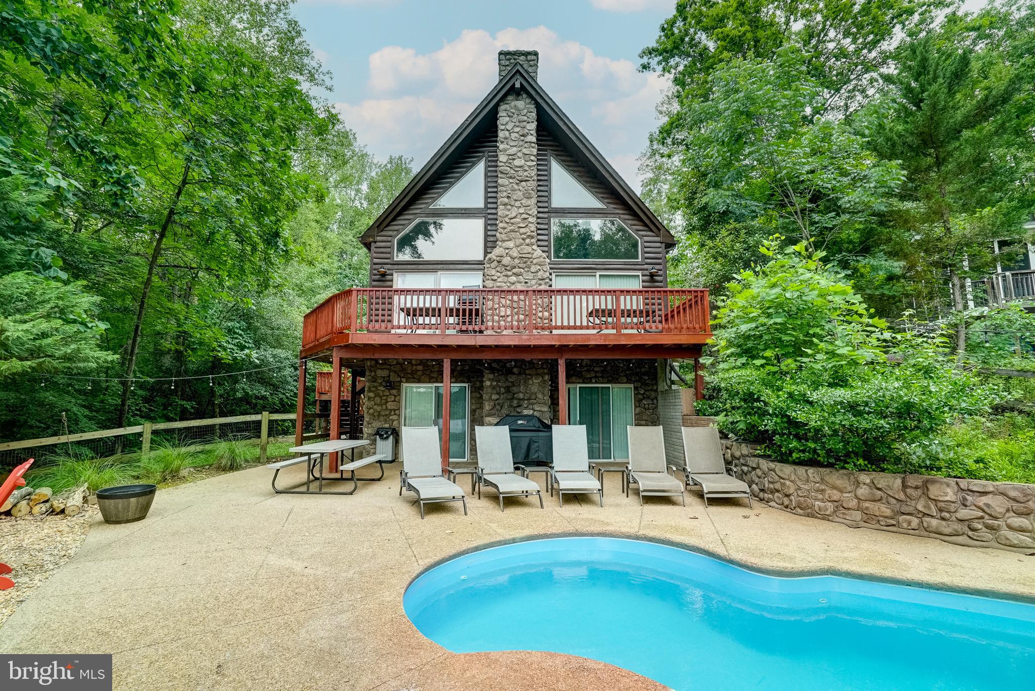 155 Irish Way Bumpass, VA 23024 - Photo 9 of 60 a view of house with backyard outdoor seating and hardwood