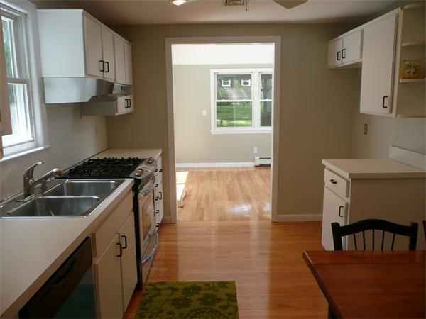 13 Montbatten Road Billerica, MA 01821 - Photo 7 of 18 a kitchen that has a sink and a stove