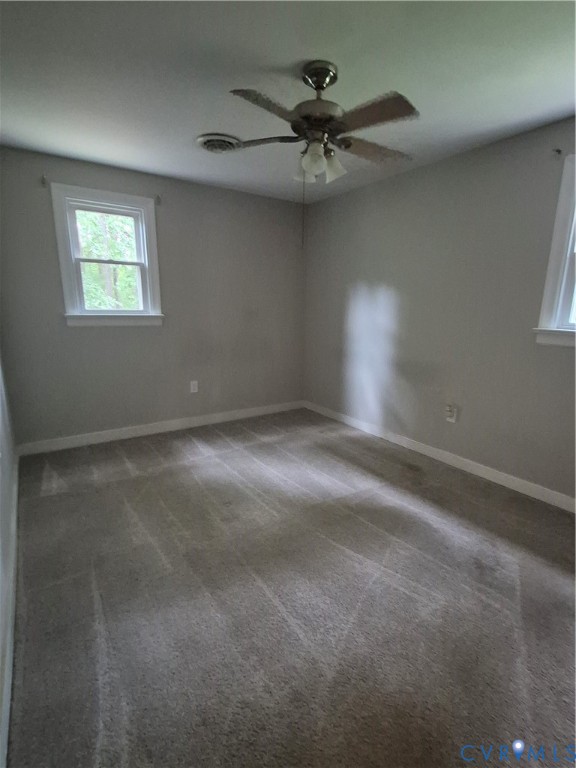 14221 Cooks Mill Road Lanexa, VA 23089 - Photo 10 of 15 Carpeted room with a ceiling fan light fixture
