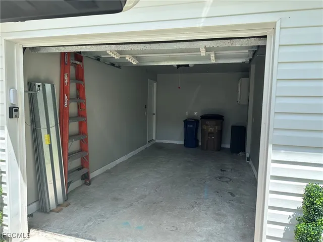 a view of a kitchen with a sink and refrigerator
