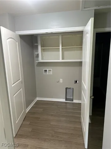 a view of hallway with wooden floor