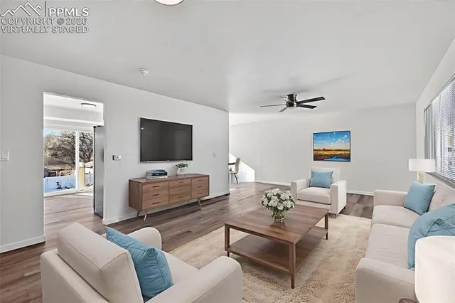 a living room with furniture and a flat screen tv