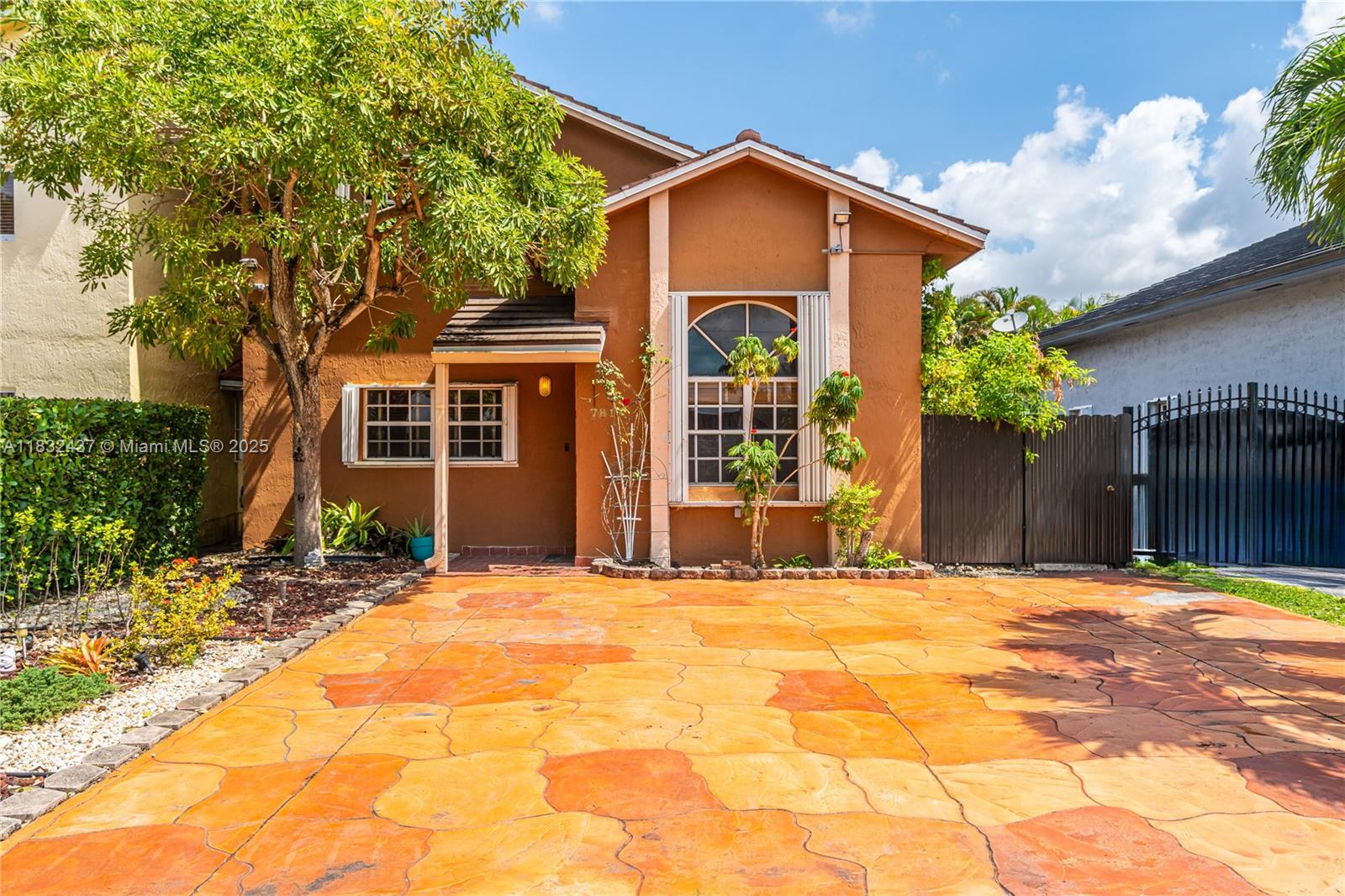 7811 Southwest 9th Terrace Miami, FL 33144 - Photo 1 of 27 a front view of a house with a yard