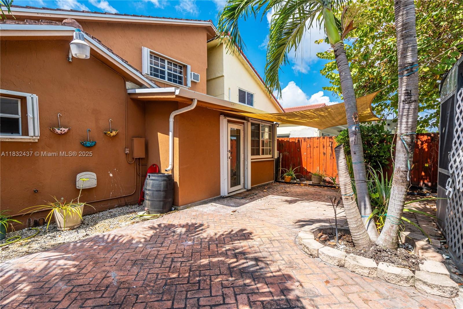 7811 Southwest 9th Terrace Miami, FL 33144 - Photo 3 of 27 a backyard of a house with seating space