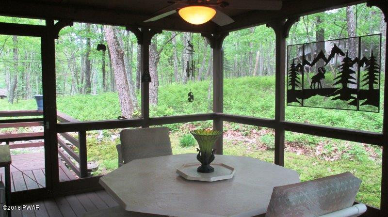 804 Rodeo Court Hawley, PA 18428 - Photo 22 of 37 a view of a porch with furniture and garden view