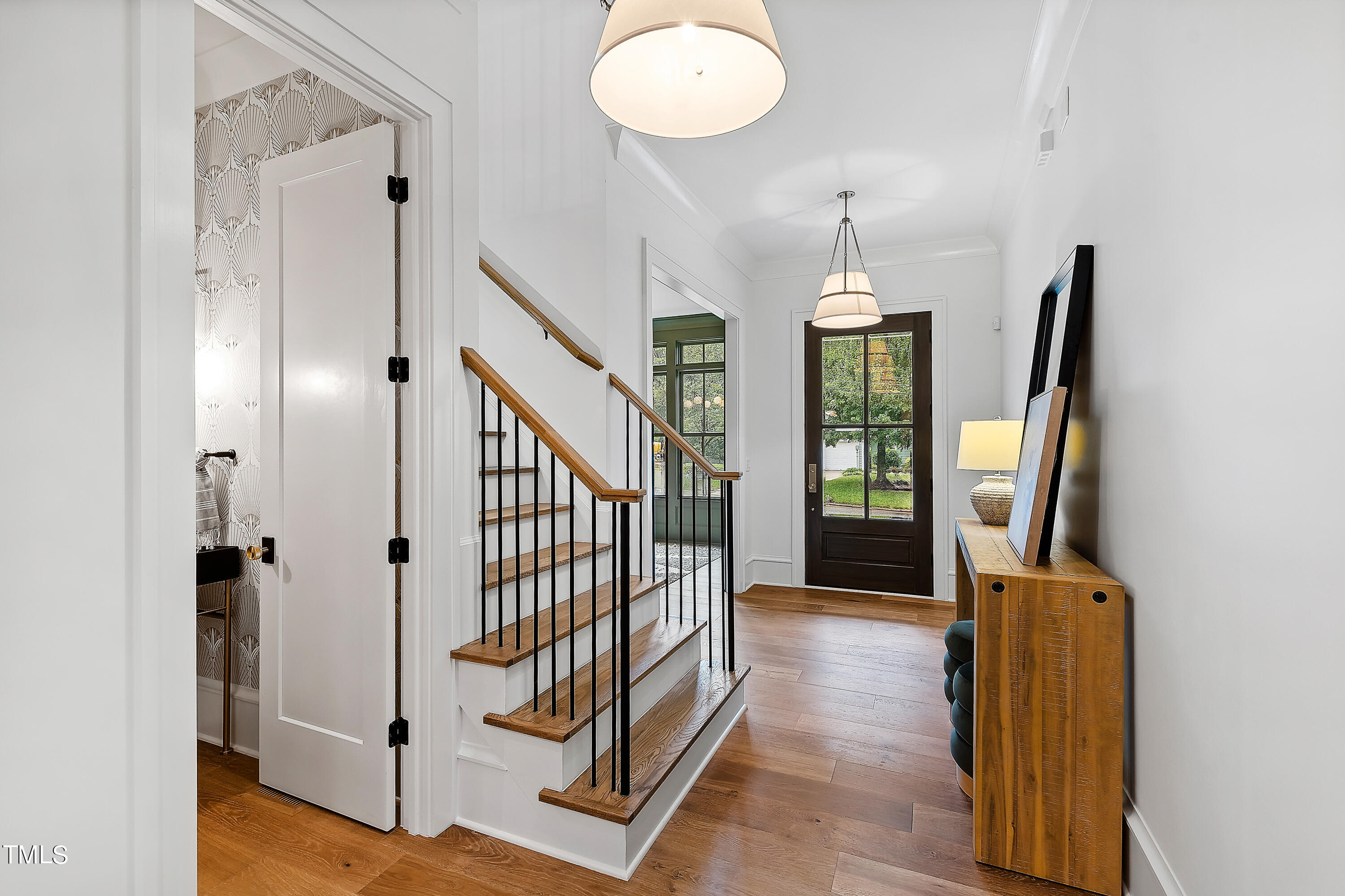 1104 Manchester Drive Raleigh, NC 27609 - Photo 2 of 52 a view of entryway with wooden floor and window