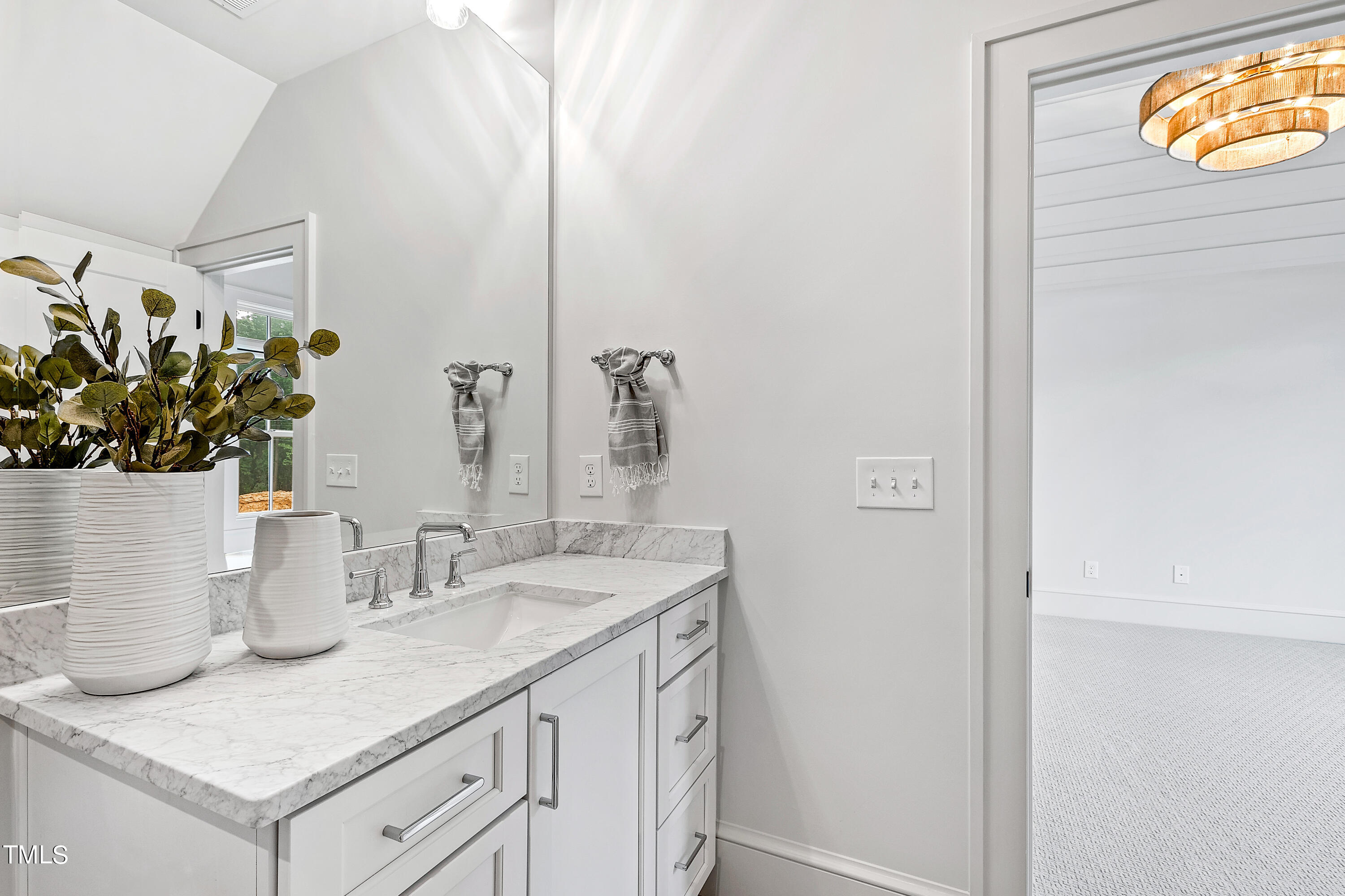 1104 Manchester Drive Raleigh, NC 27609 - Photo 24 of 52 a bathroom with a sink and a mirror